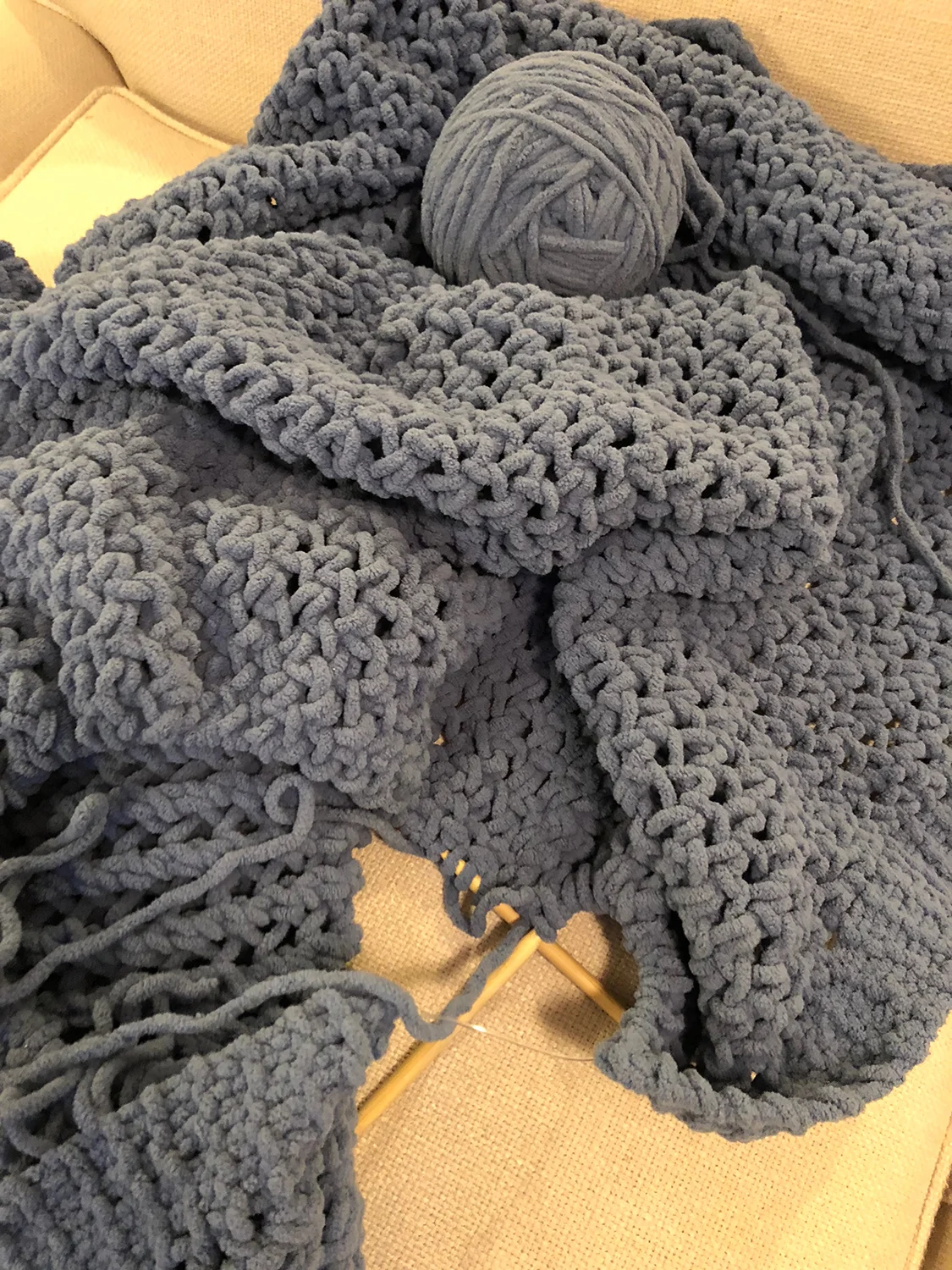 Chunky yarn hand knitted throw with knitting needles