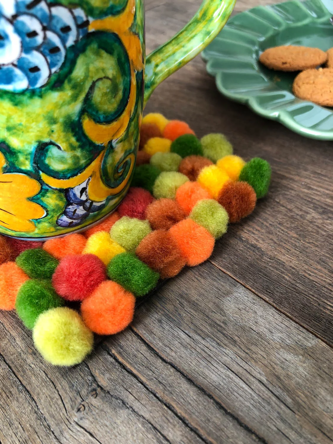 Completed make-it-yourself DIY pom-pom coaster