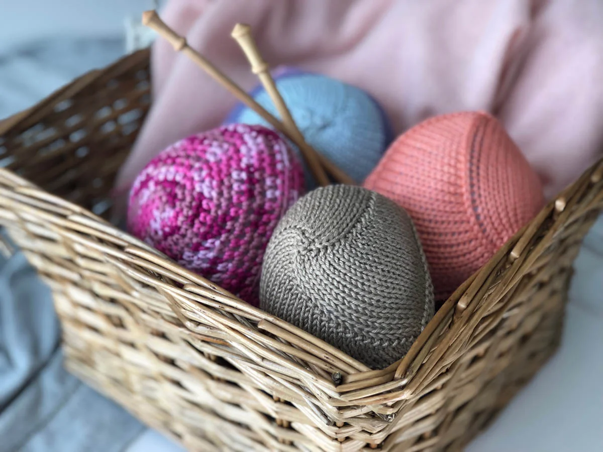 Knitted Knockers in basket, ready to be gifted