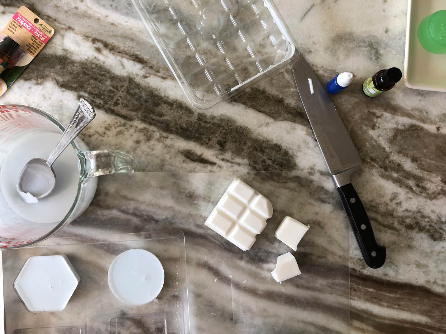 goat milk soap in molds and cubes being cut