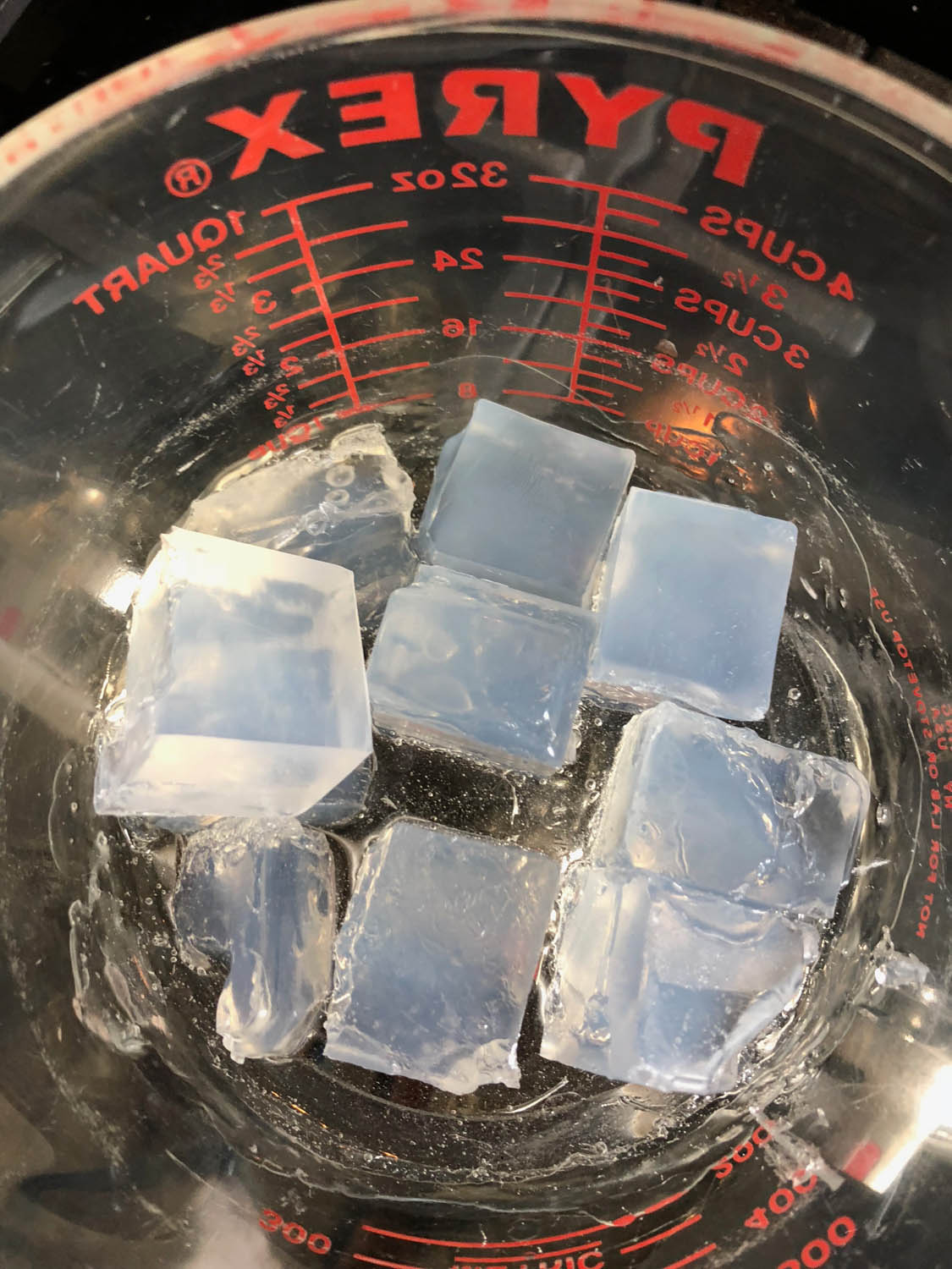 half way through melting soap in glass measuring cups