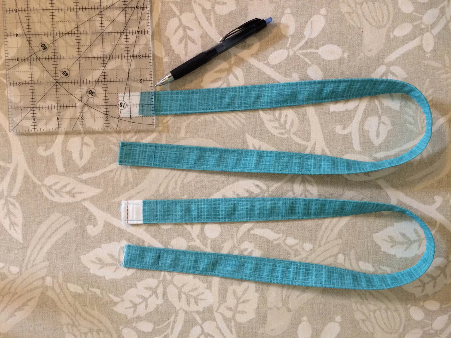 marking bottom of each strap for placement