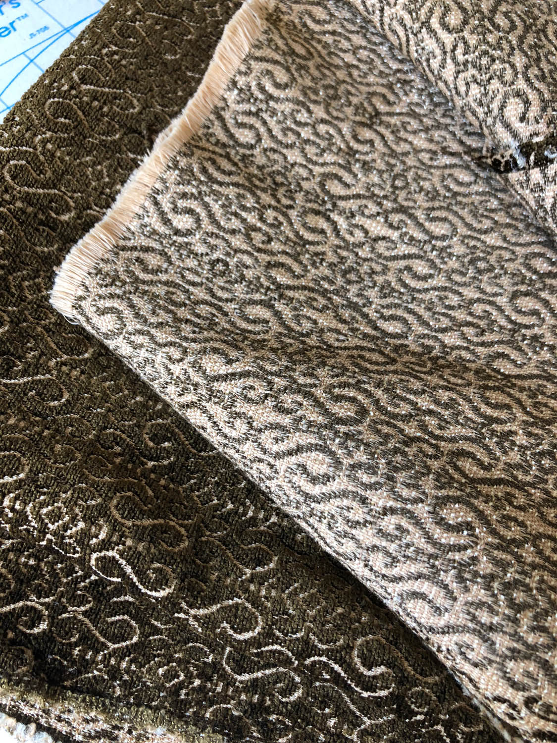 Front and back sides of reversible upholstery fabric used to make a no-sew Christmas tree skirt.