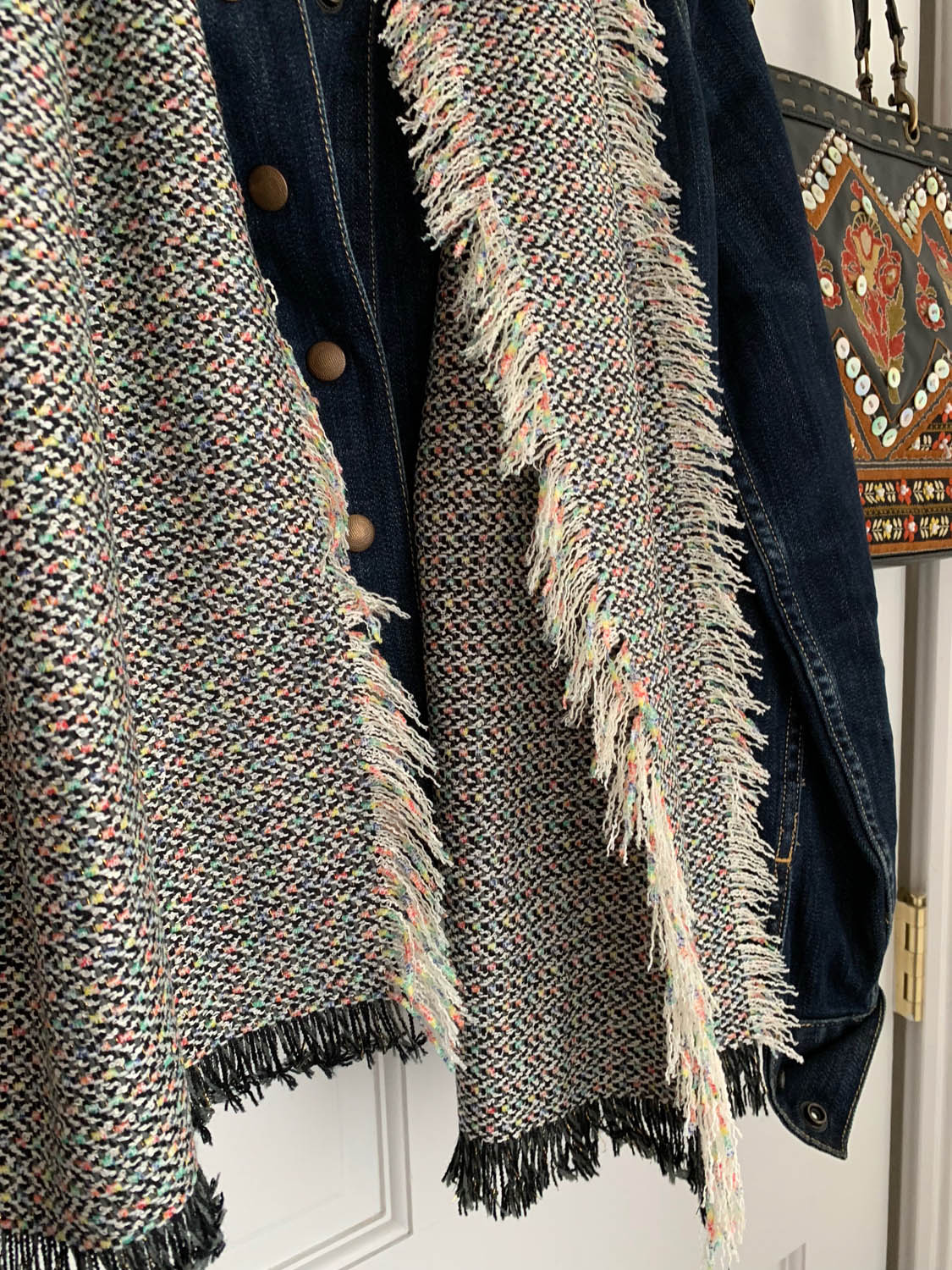 Finished fringe on fast no-sew upholstery fabric scarf draped over denim jacket