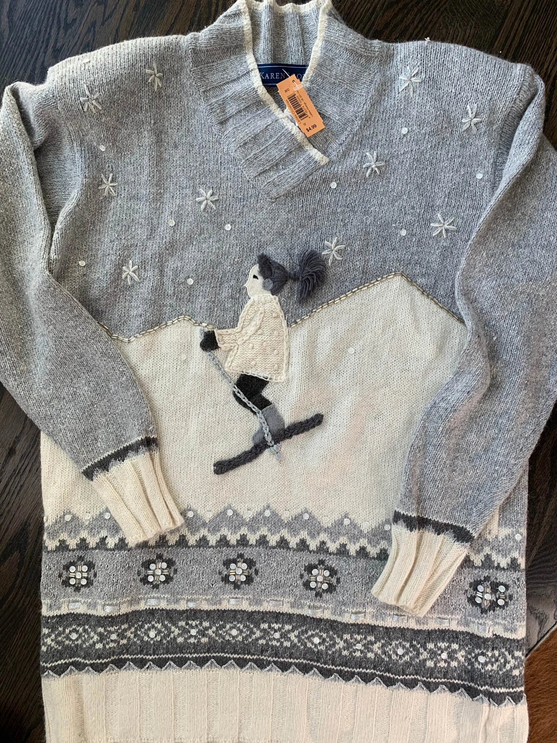 Holiday sweater found at thrift store to make an upcycled pillow; gray and white with girl skiing.