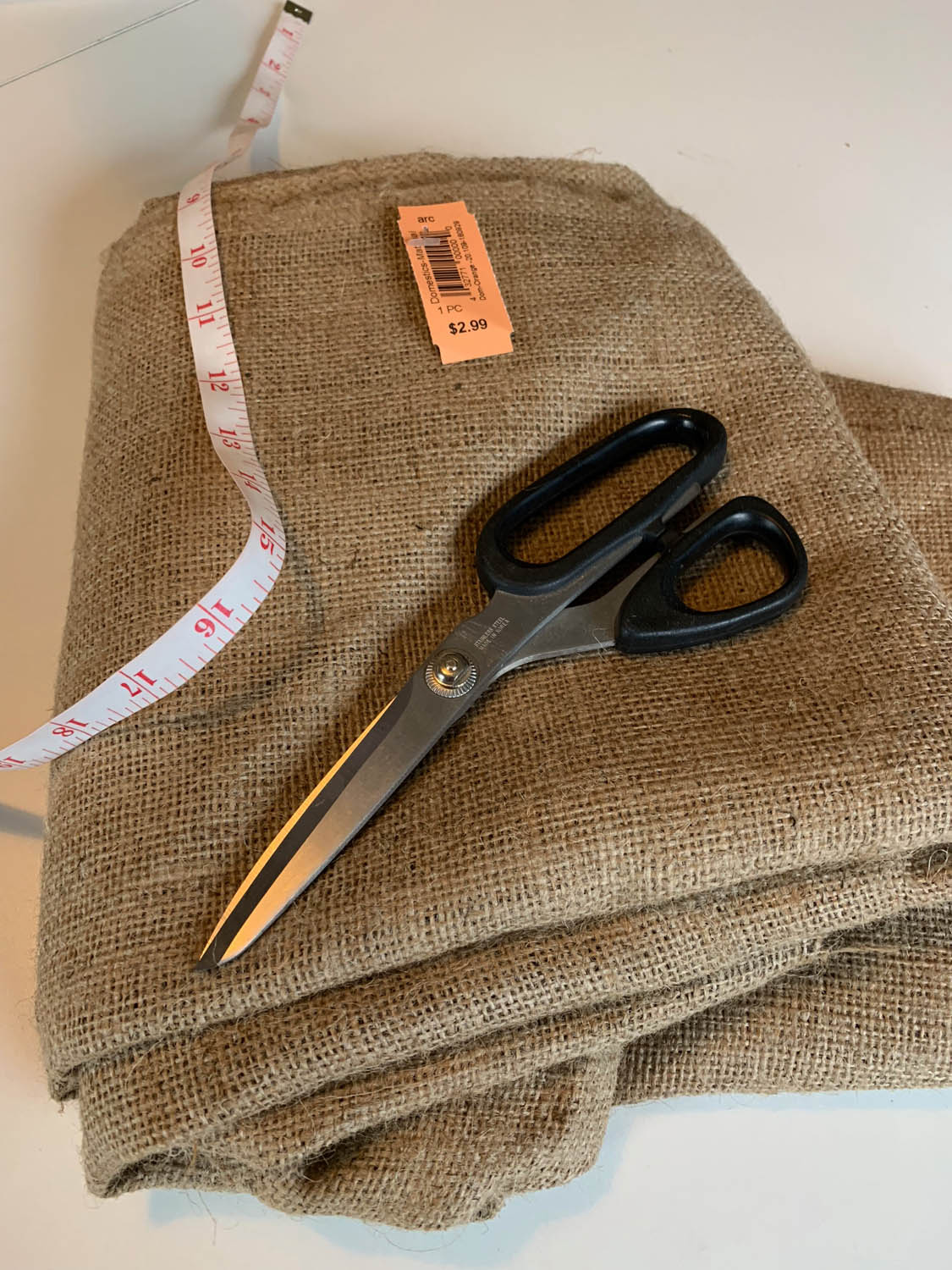 Burlap yardage with scissors and tape measure