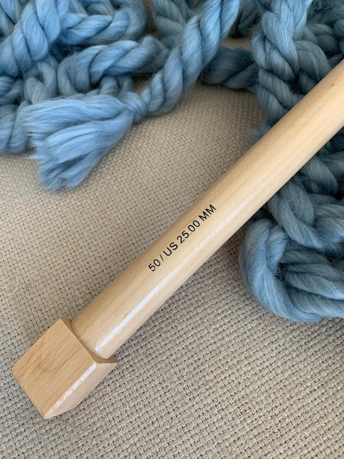 jumbo knitting needle size 50 25mm with blue yarn swatch