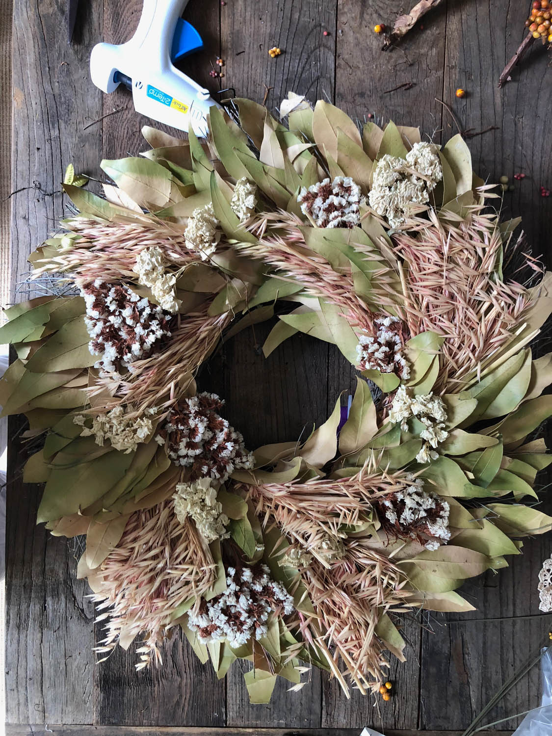 Faded old wreath ready for upcycle redo.