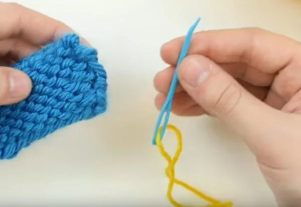 plastic tapestry needle and knitted swatch