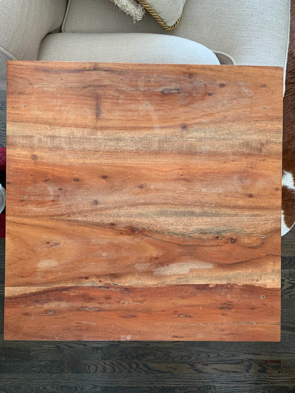 top view of old end table with stains and water marks