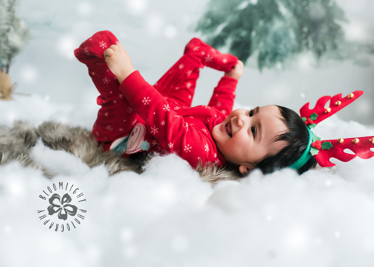 Happy 9 months old Baby wearing red Christmas pijama