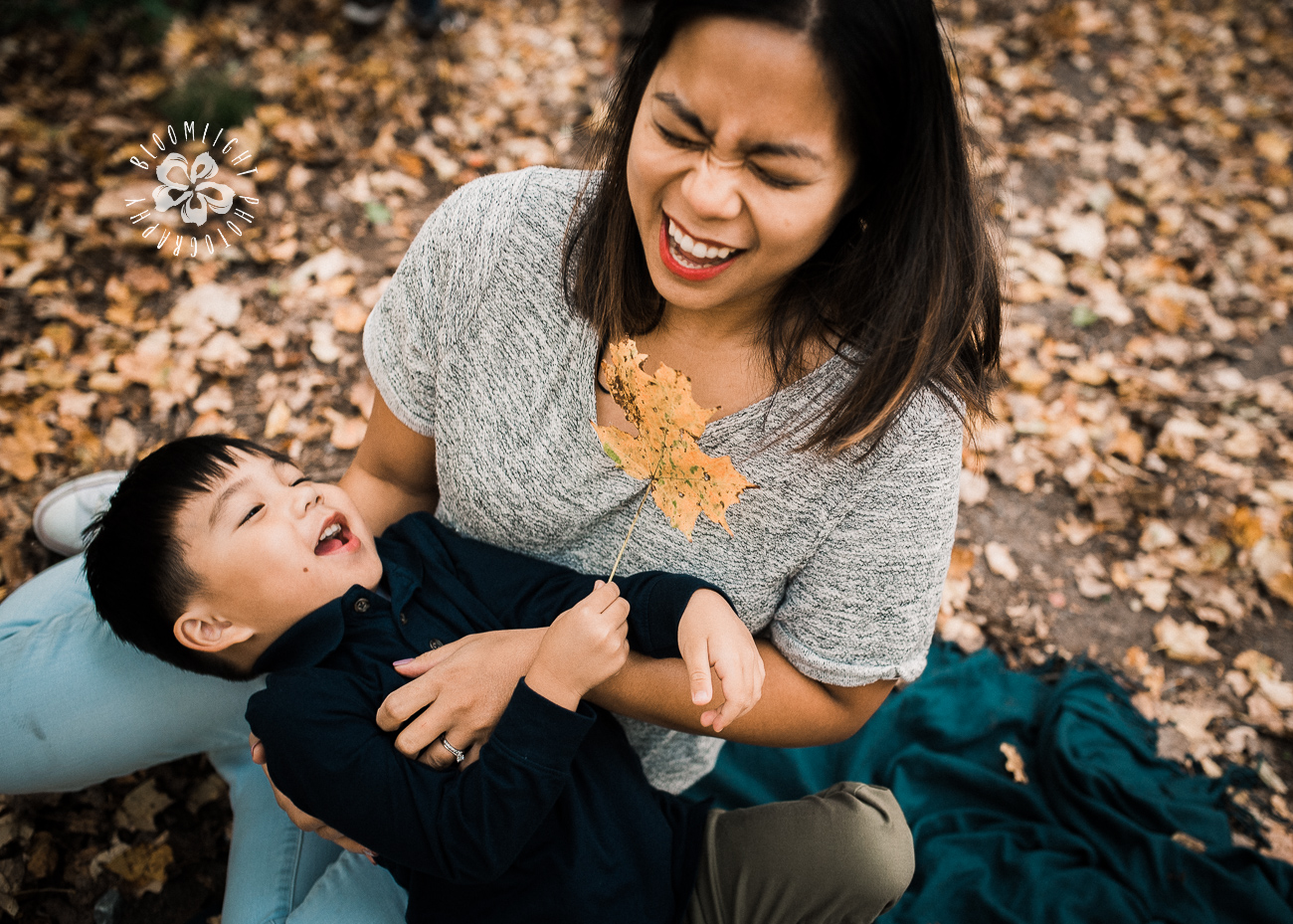 Fun moment between mom and her child in beautiful fall season