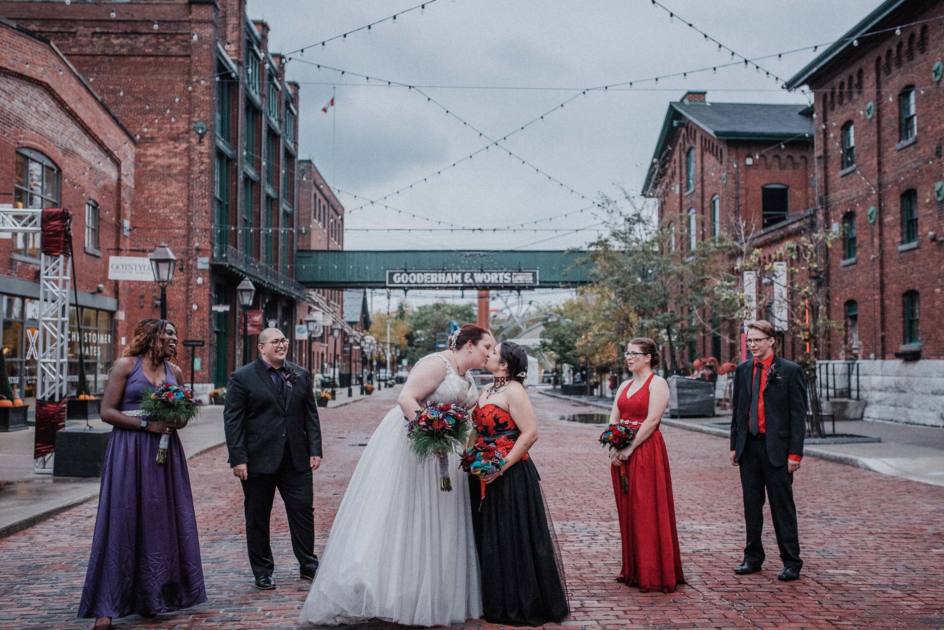 Two brides kissing in the Distillery, Toronto