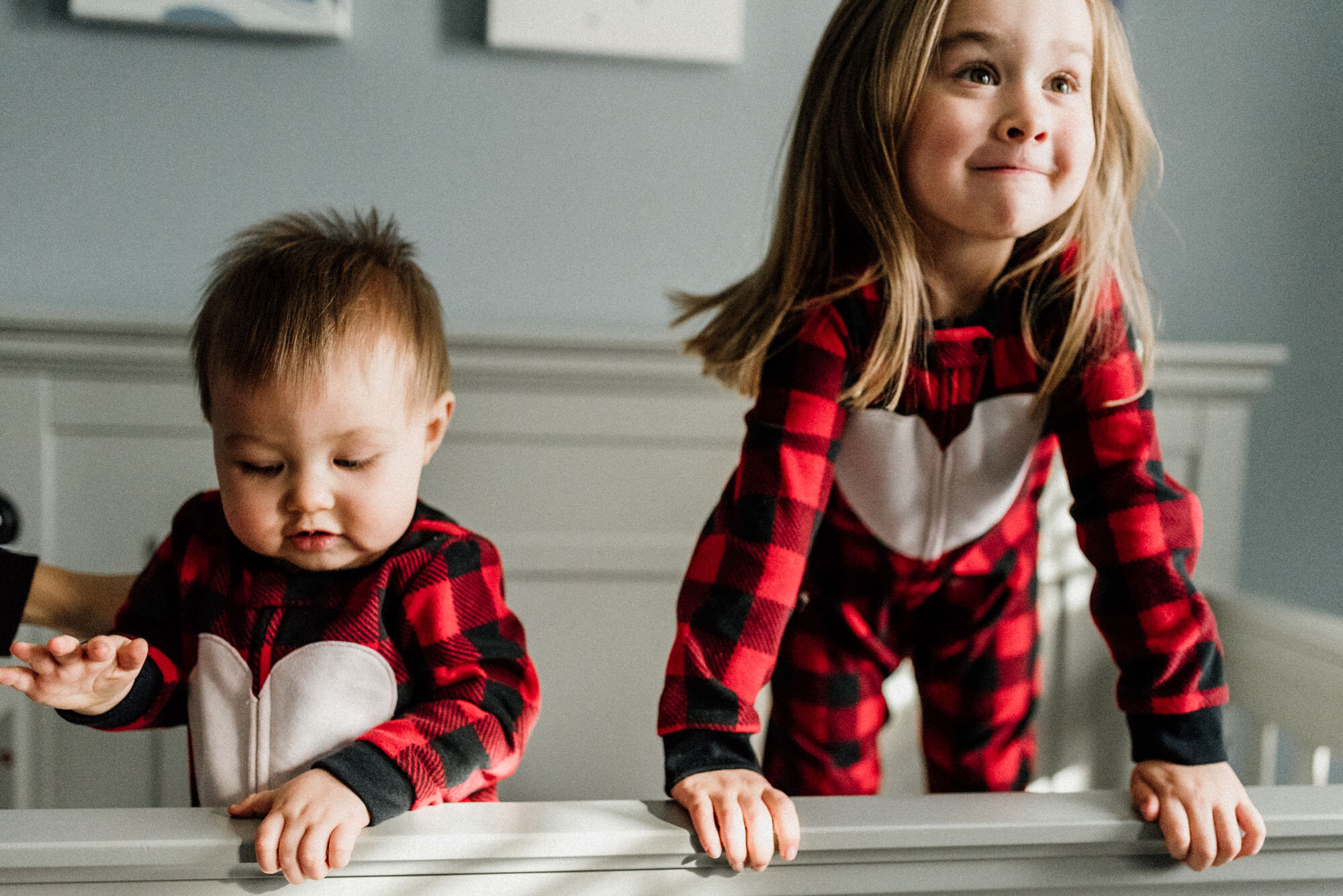 kids having fun, jumping on the crib at Christmas time