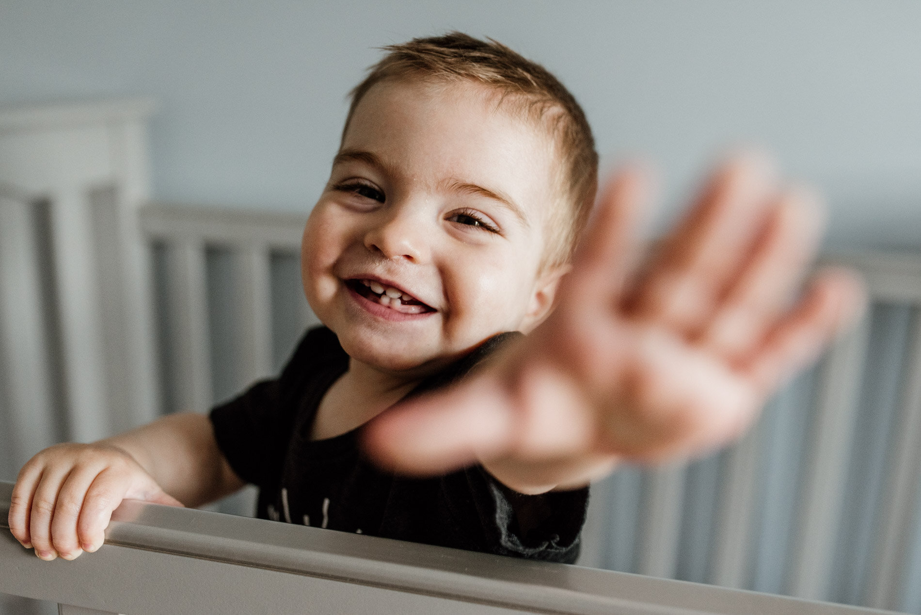 happy-baby-boy-standing-in-crib-photo-Whitby.JPG