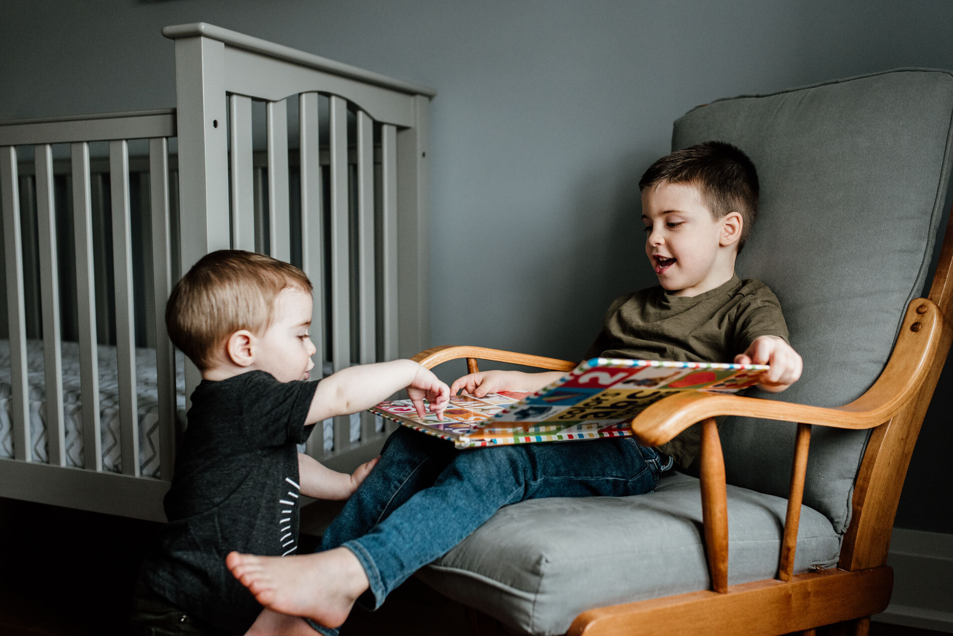 reading-book-baby-brothers-at-nursery-Durham-region-lifestyle-photographer.JPG