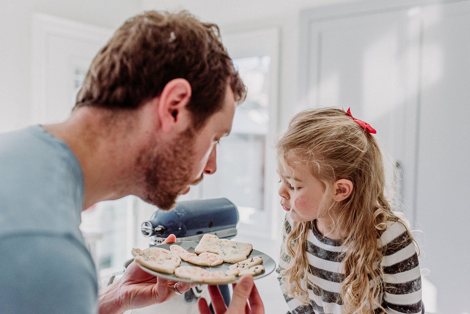 daddy and daughter in the kitchen at home baking