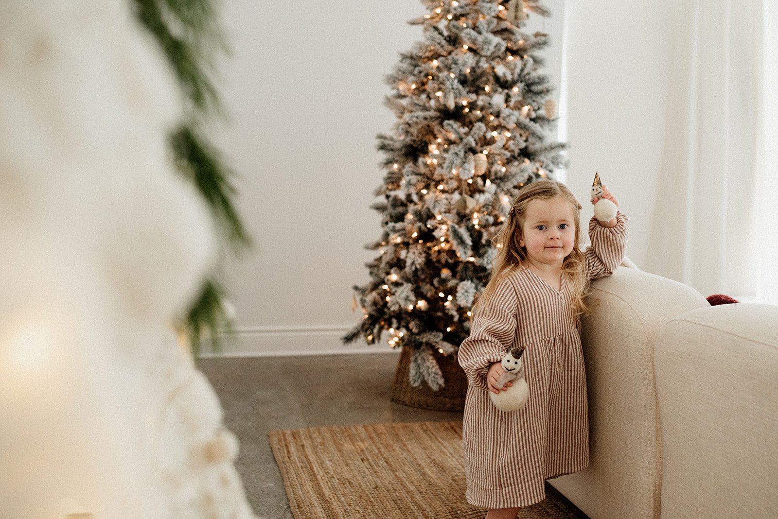 photo of little girl in minimalistic Christmas set up in a Toronto studio