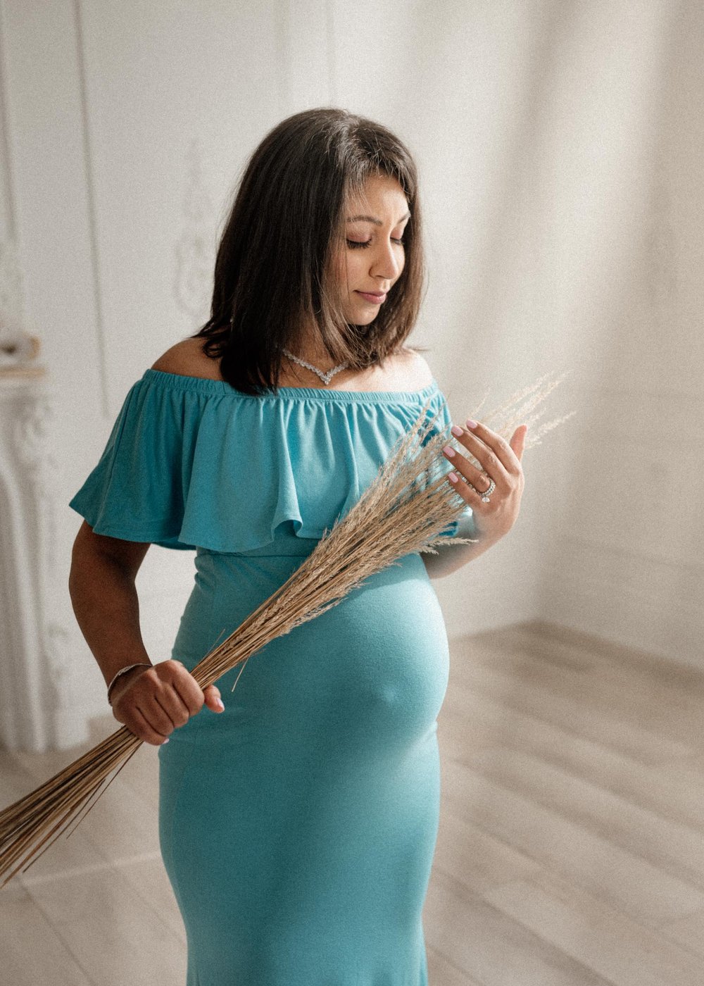 dreamy pregnancy photo of a mom at a Toronto studio