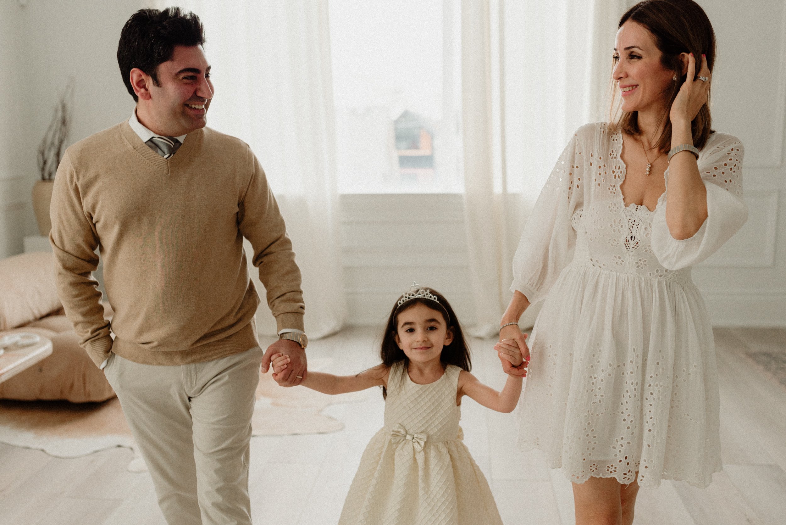 happy family of 3 in mint room studios, Toronto