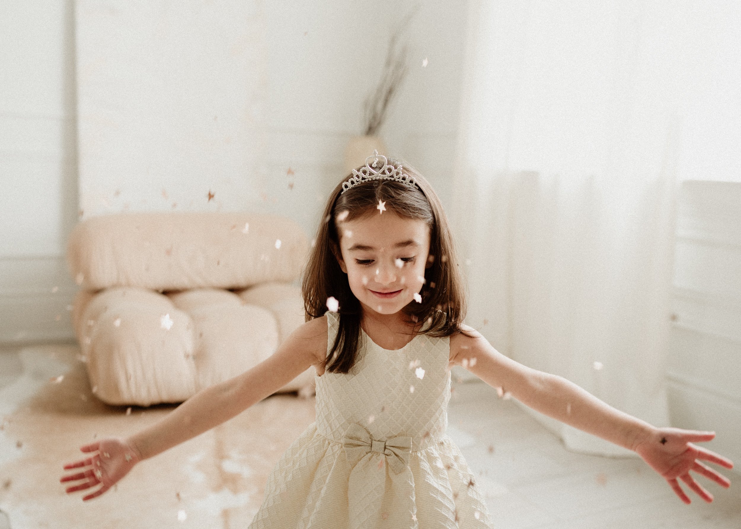 picture of a toddler girl having fun with glitter 