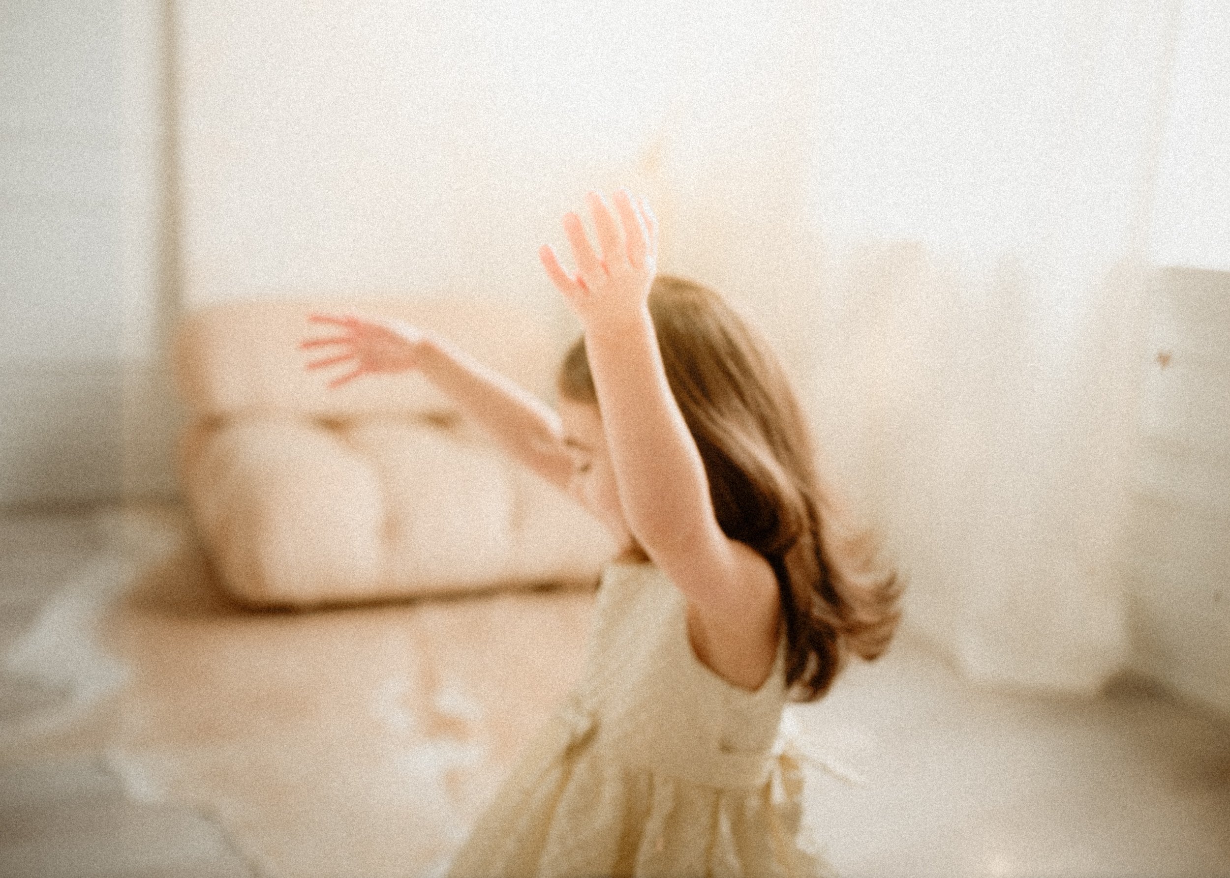 magical photo of a toddler girl dancing in a studio in Toronto