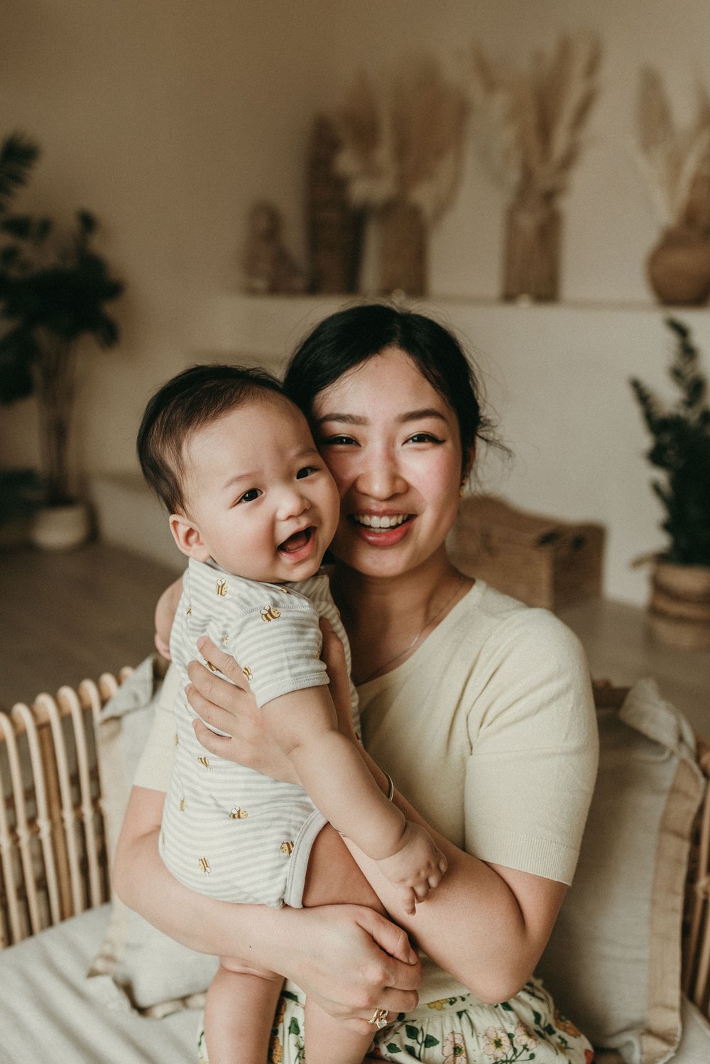 Happy mommy and baby laughing and cuddling