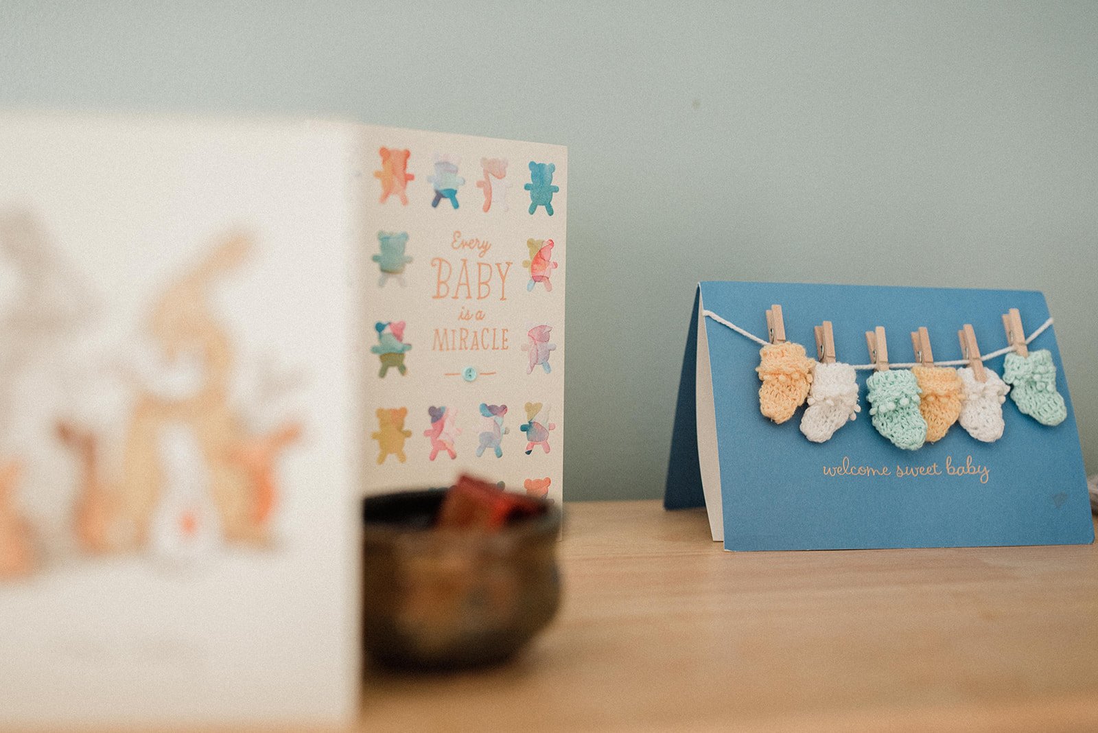 cute cards for baby's arrival displaying in the nursery
