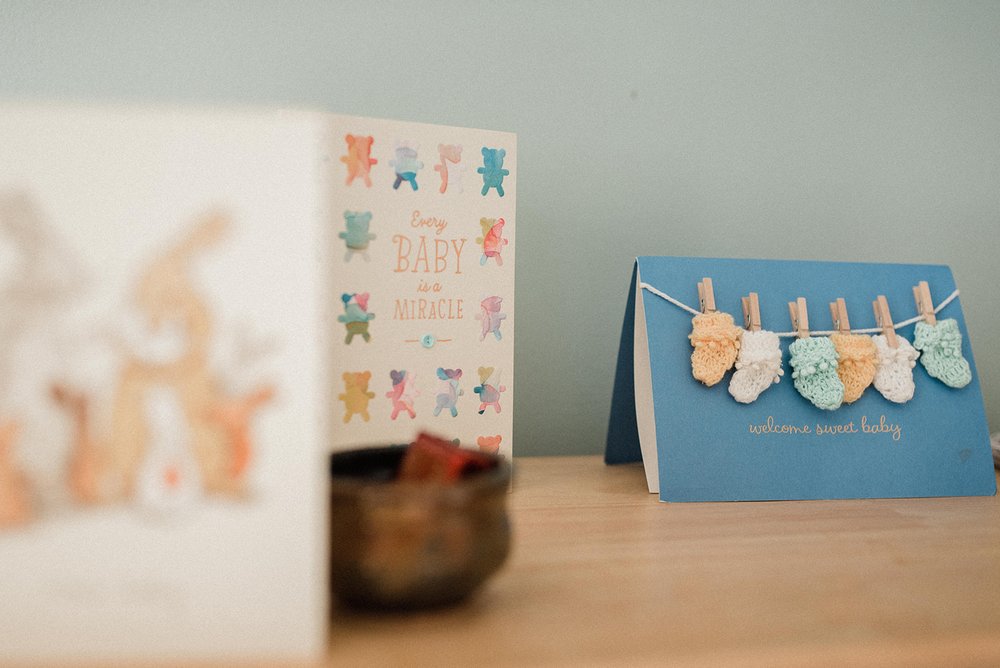 cute cards for baby's arrival displaying in the nursery