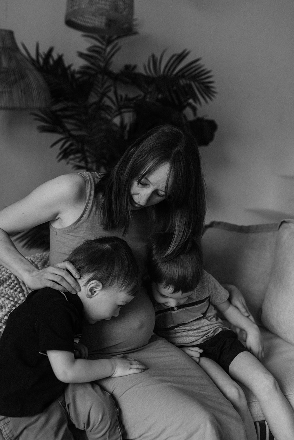 Motherhood photo of a pregnant mom and her boys