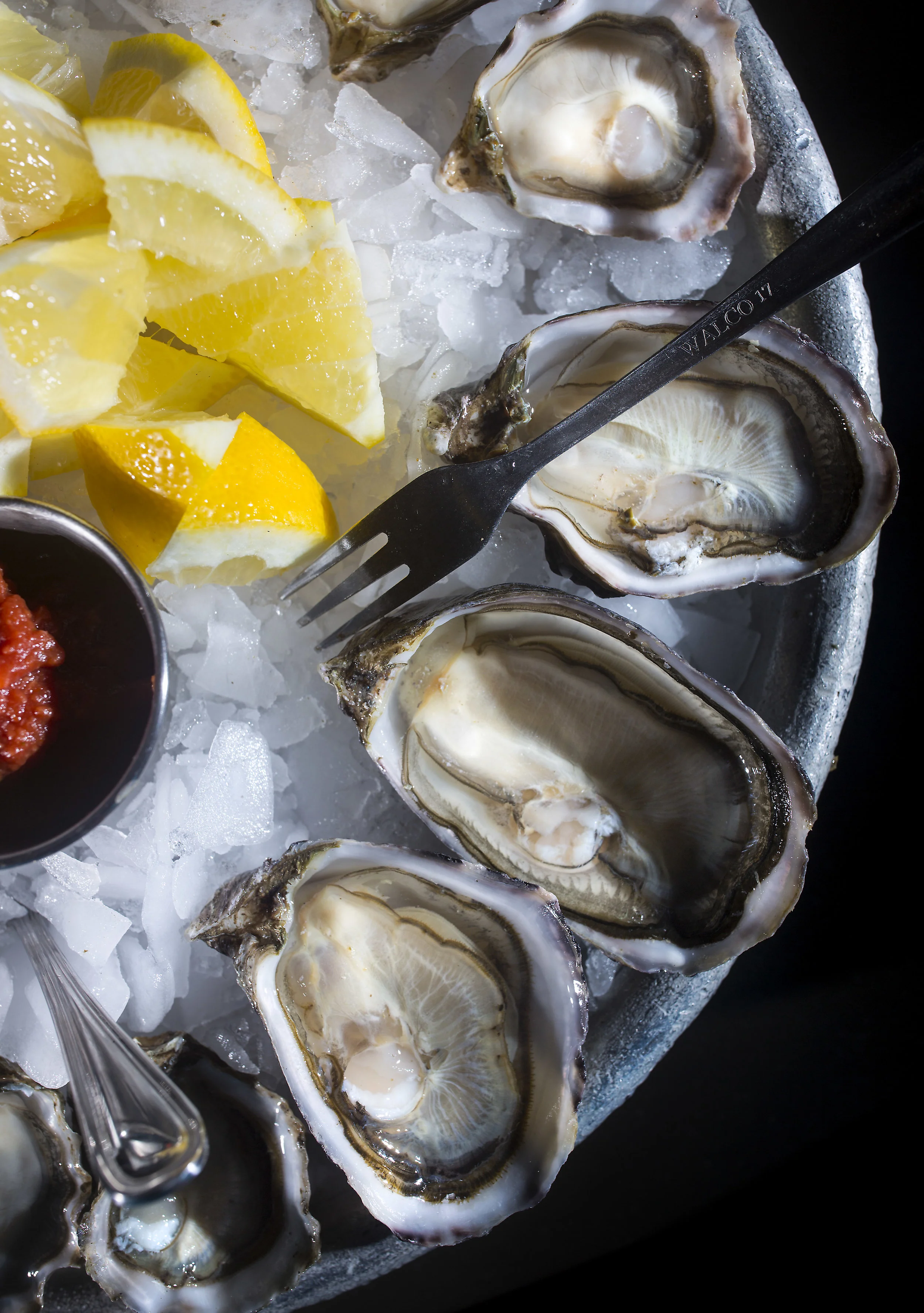 (Clockwise) The Kusshi, Fat Bastard, and Kumamoto oysters freshly shucked at Taylor Shellfish Farm's retail shop overlooking Samish Bay.