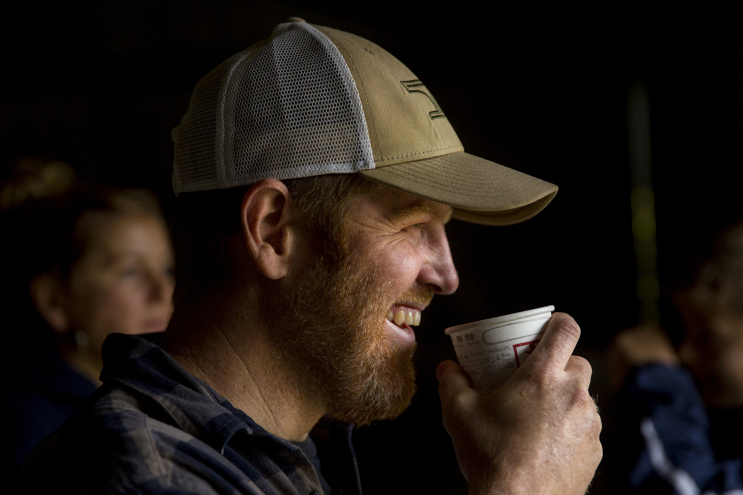  Brady Turner, co-owner of the local restaurant Pickled Fish, sips a cup of coffee while take a break in the farm shed during the annual harvest at Starvation Alley Farms. (Sy Bean / Seattle Refined) 