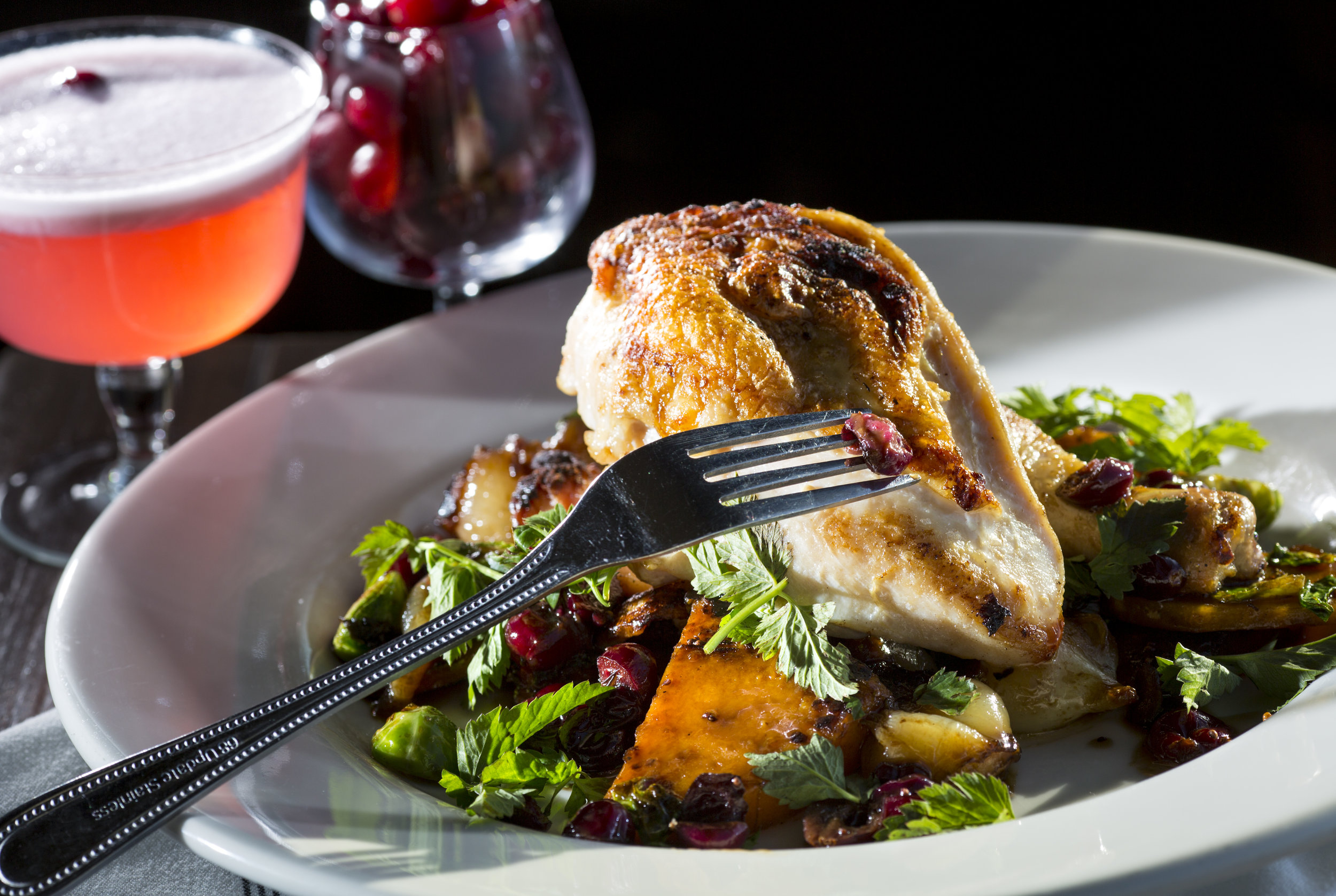  The half chicken, with butternut squash agrodolce, cranberry jus, brussels sprouts, cipollini onions, and sage, at Pickled Fish, located at 409 Sid Snyder Dr, Long Beach, WA. (Sy Bean / Seattle Refined) 