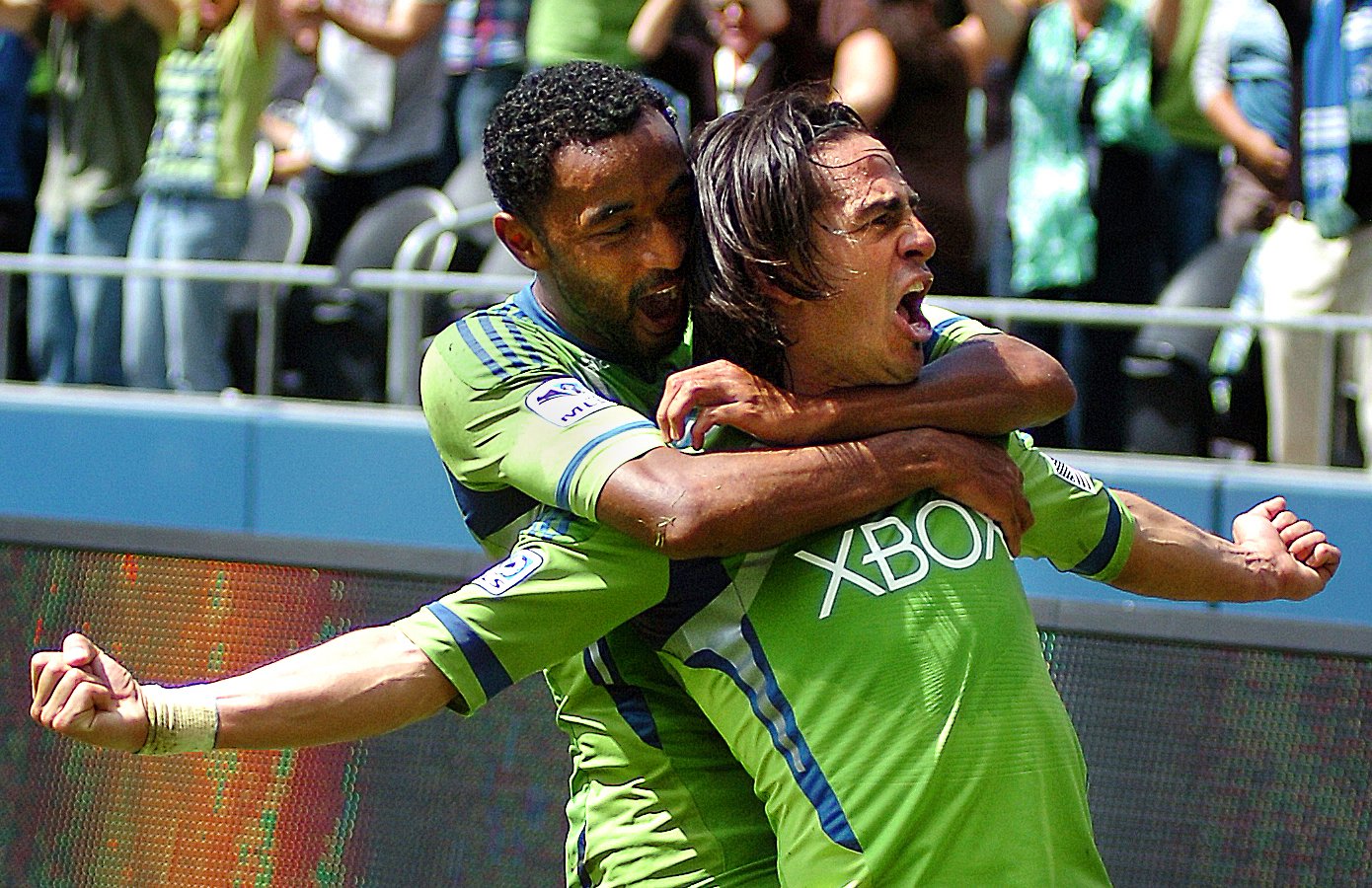  Seattle Sounder Mauro Rosales, right, gets a congratulatory hug from defender James Riley after scoring a goal off of a feed from Fredy Montero against the Colorado Rapids at CenturyLink Field in Seattle, Saturday, July 16, 2011. Rosales' goal prove