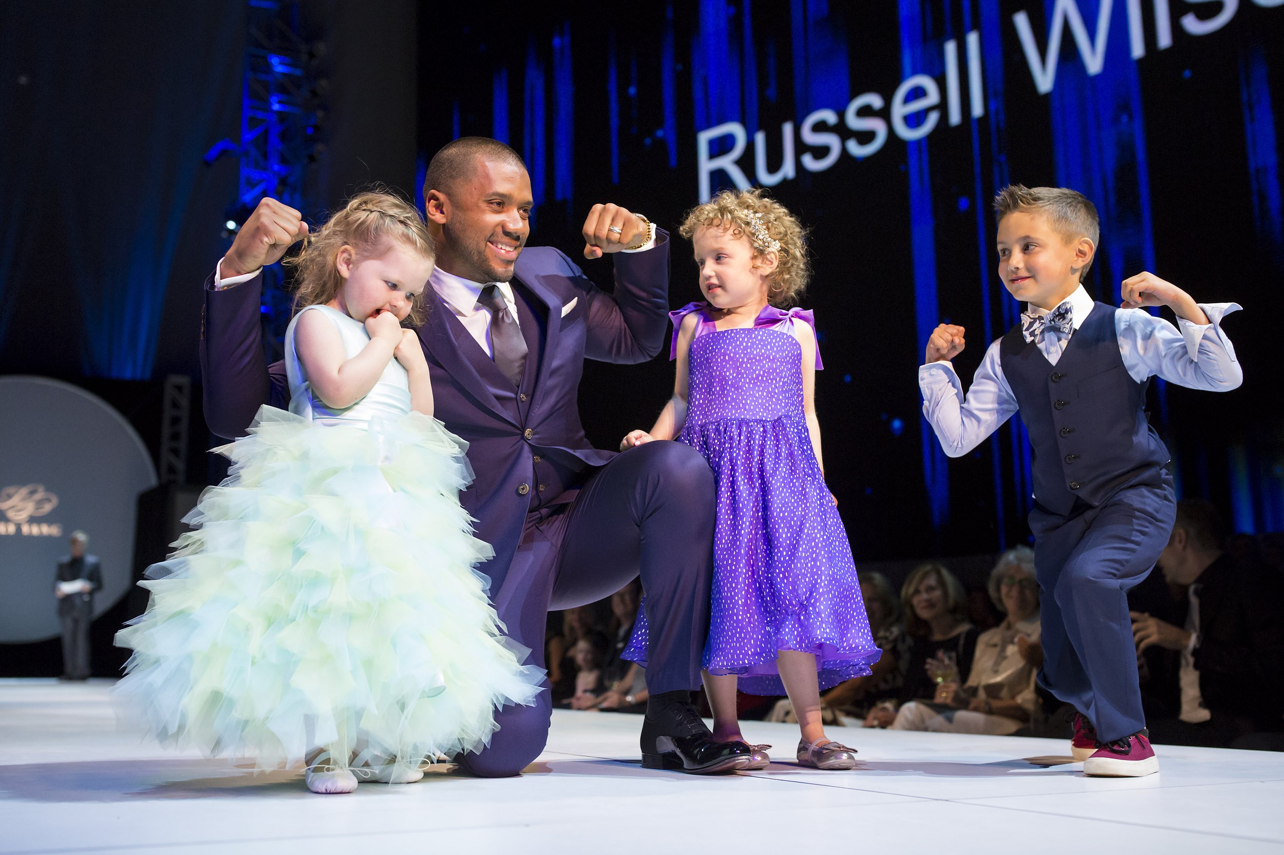 Local designer Luly Yang’s fashion show got a little bit of star power last night! Seahawks quarterback Russell Wilson came to the eclipse-themed fashion show that benefited the important work of StrongAgainstCancer. After Wilson gave his remarks, t