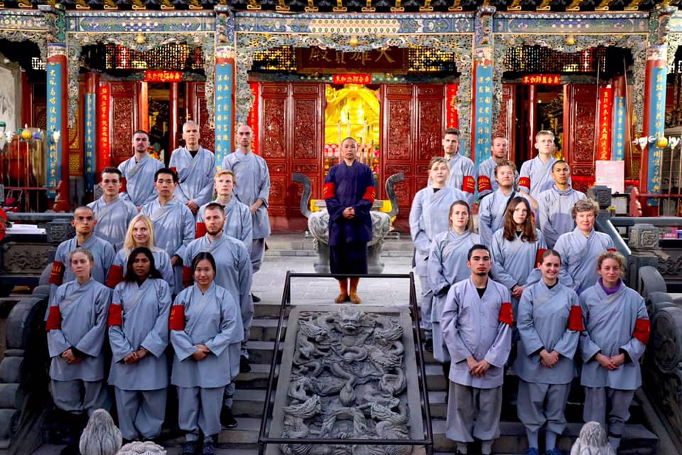  Yunnan Shaolin temple kung-fu group 云南少林寺 led by master Shi Yan Jun 释延君 with foreign students ready for the Chinese New Year 春节.  source:  International Shaolin Disciples Society  