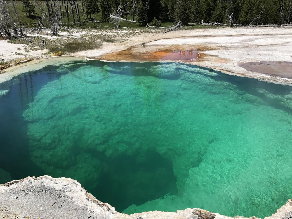 This brilliant turquoise geyser pool