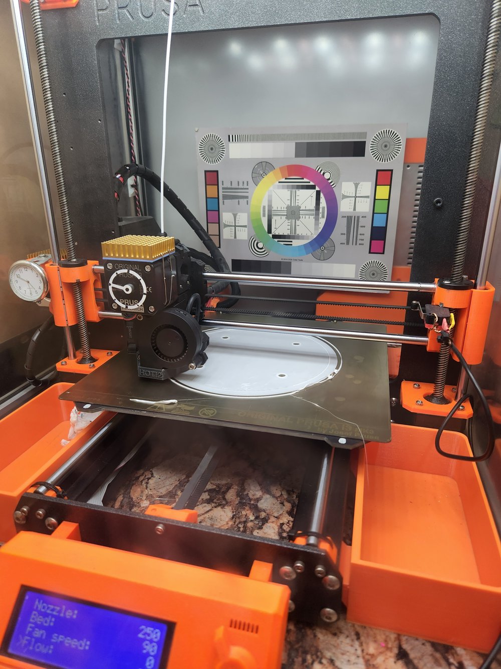 3D printer laying down the first layer of a hemisphere print.