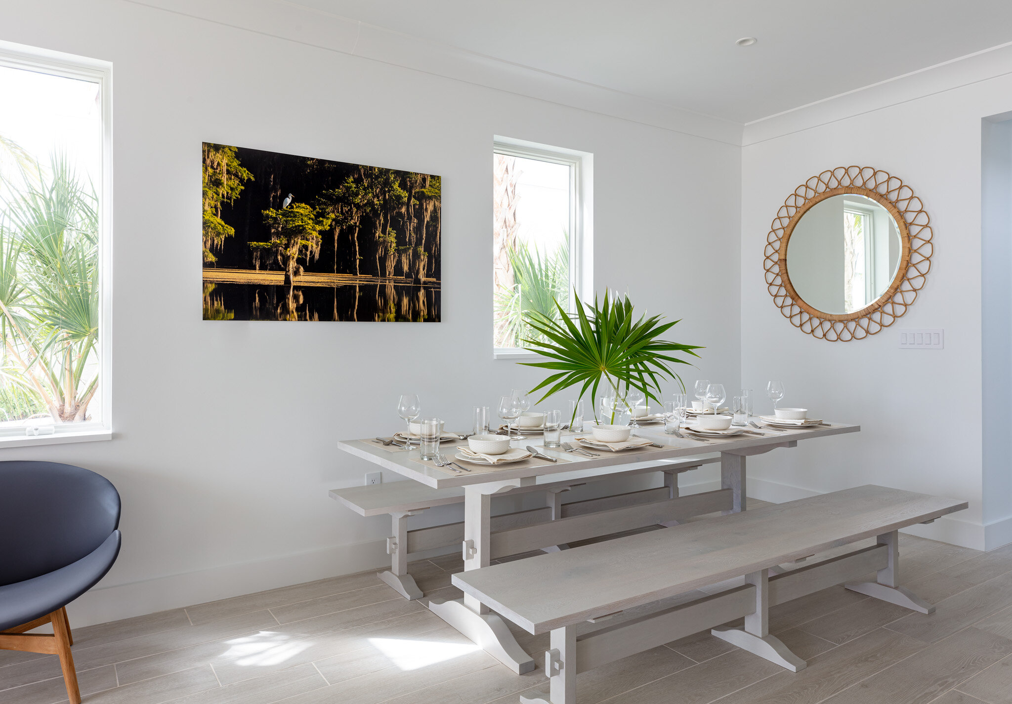  Dining room table set for a meal in an Islands waterfront villa. 