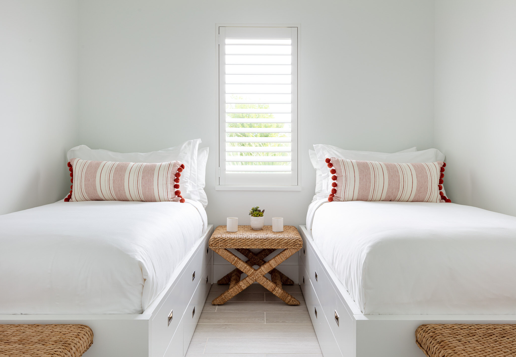  Twin beds in an Islands waterfront villa second-floor bedroom. 