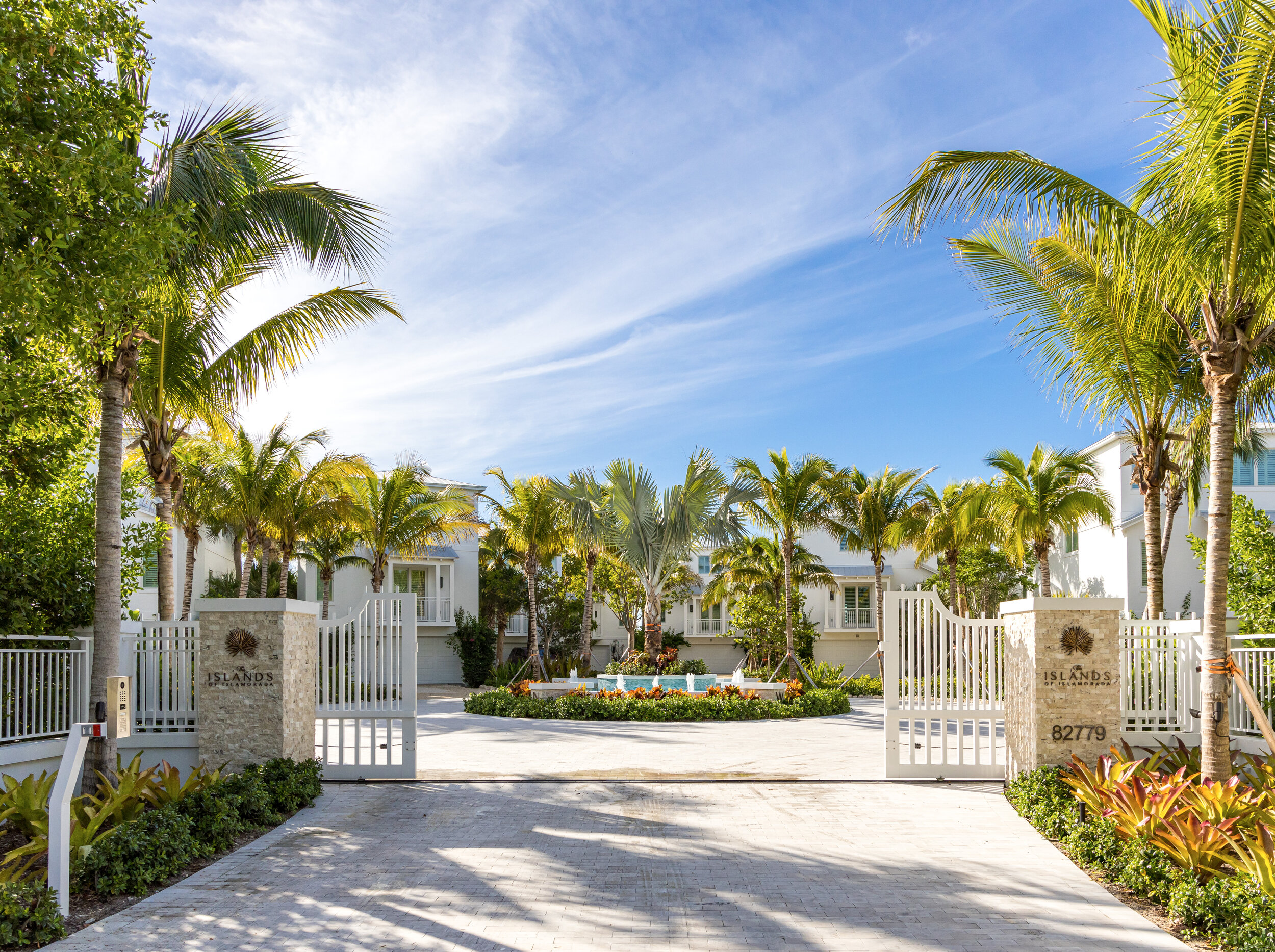  The Islands of Islamorada’s entrance gates, surrounded by palm trees. 