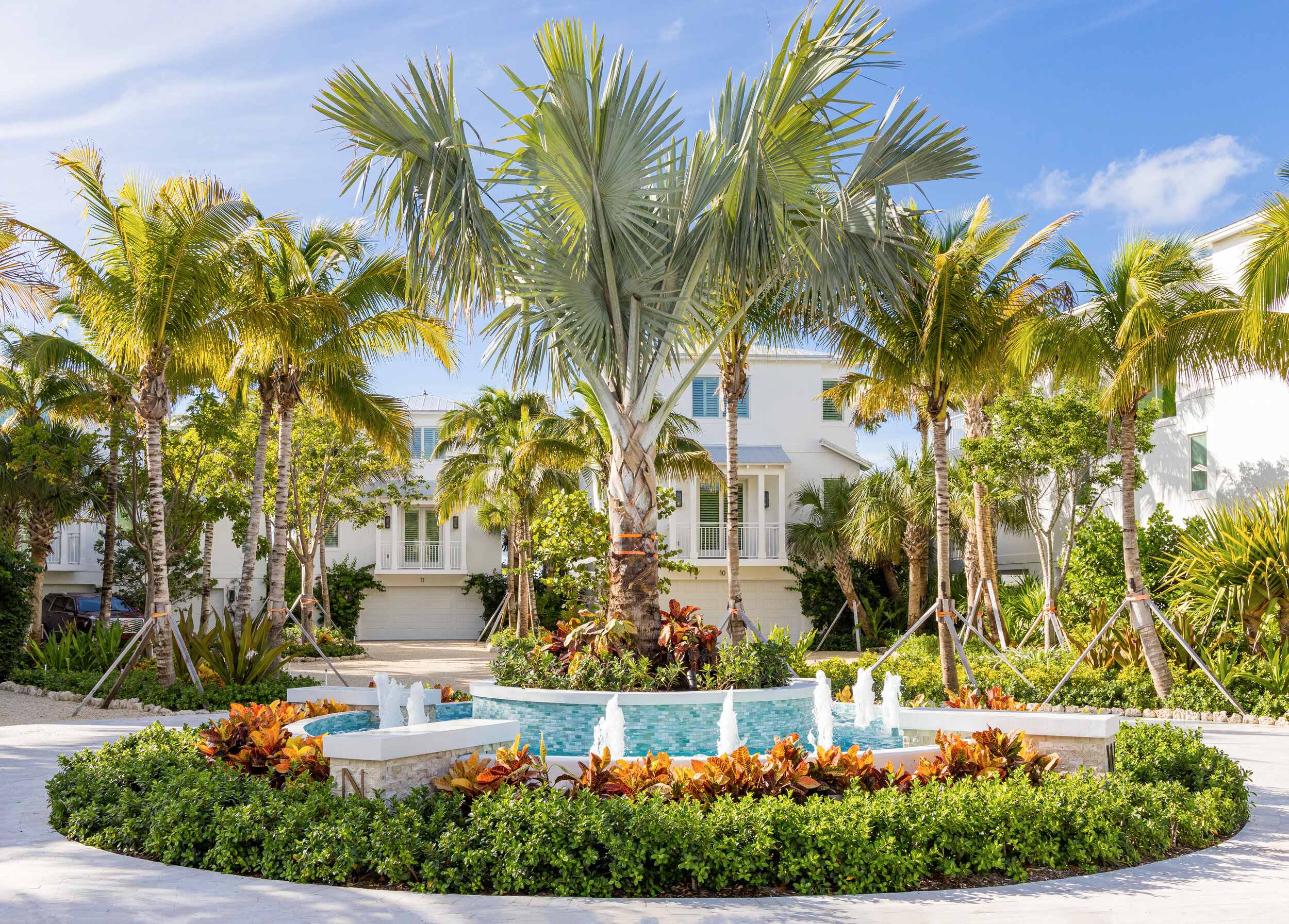 Palm trees, gardens, and fountain at The Islands of Islamorada’s front entrance. 