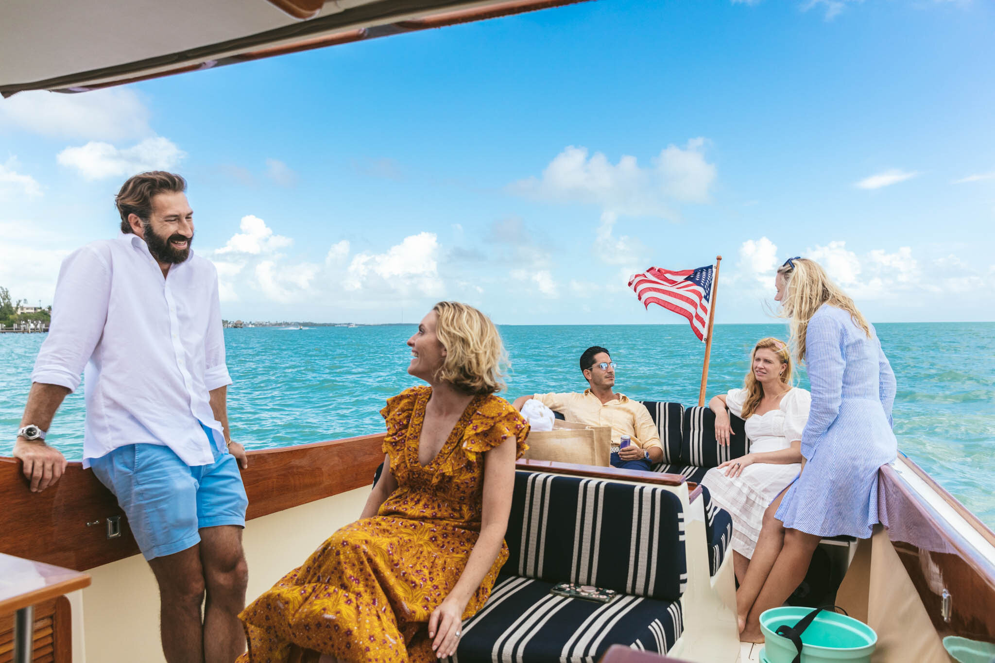  Group Of Friends And Family Aboard A Boat In The Crystal Blue Atlantic Ocean By The Islands Of Islamorada In Florida. 