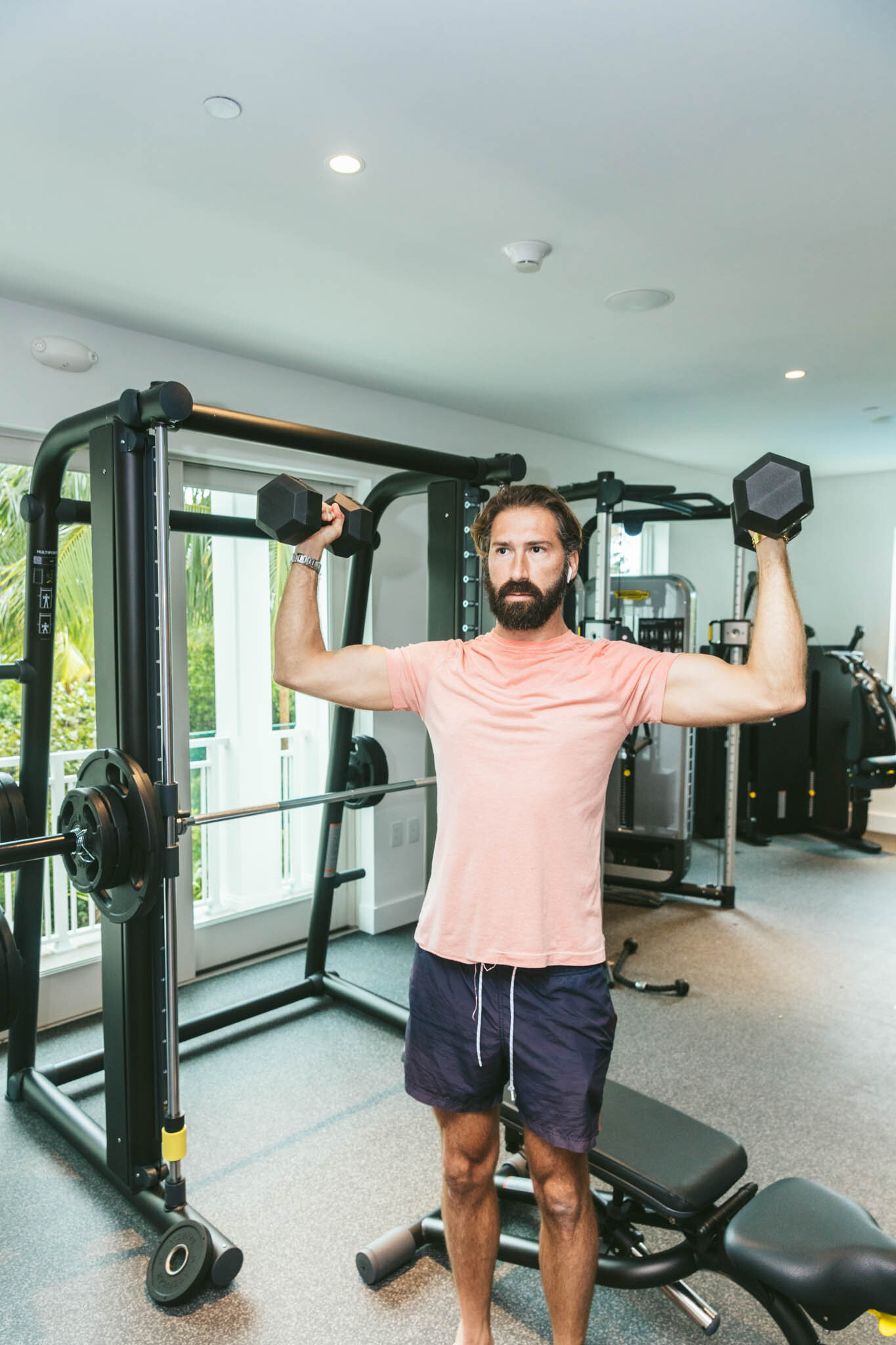  Man Lifting Weights While On Vacation Inside The Islands Of Islamorada’s Fitness Pavilion. 