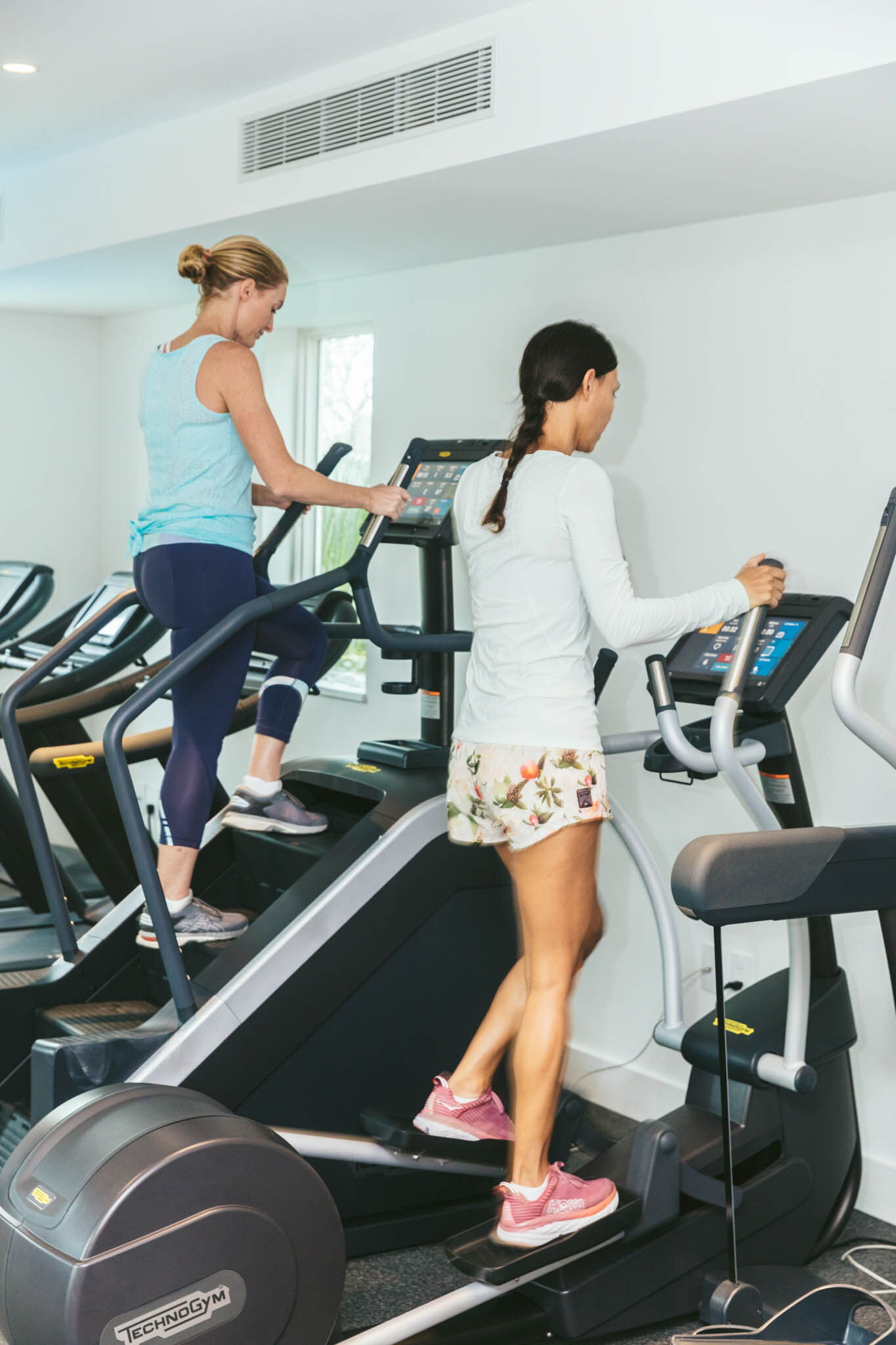  Two Women Exercising On Step Machines In The Islands Of Islamorada’s Fitness Pavilion While On Vacation In Florida. 