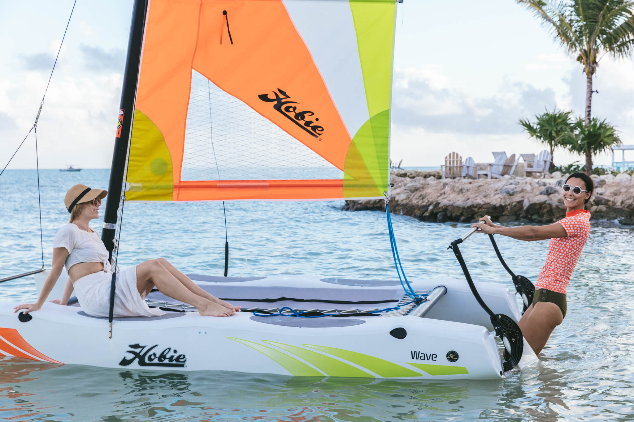  Two Women Set Sail Off The Coast Of Florida On A Sailboat From The Islands Of Islamorada’s Private Beach. 