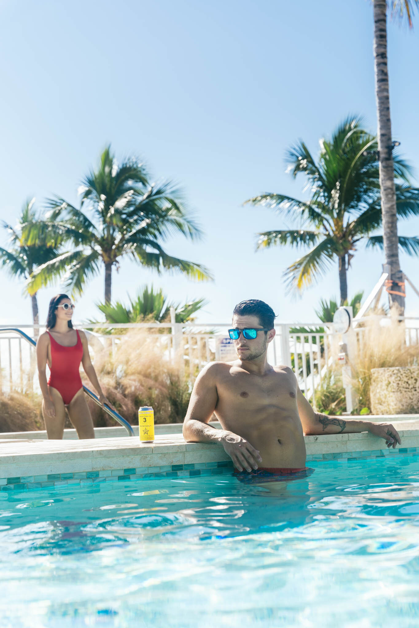  Couple hanging out in The Islands of Islamorada’s private beachside pool. 
