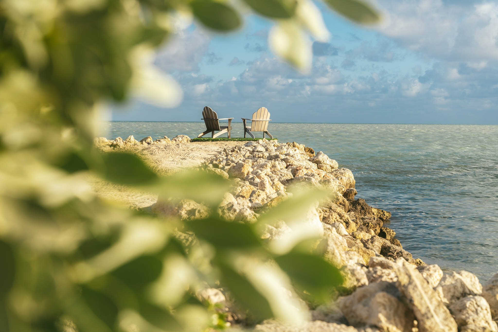  Two chairs sit on the edge of The Islands of Islamorada’s private jetty looking out onto the Atlantic Ocean. 
