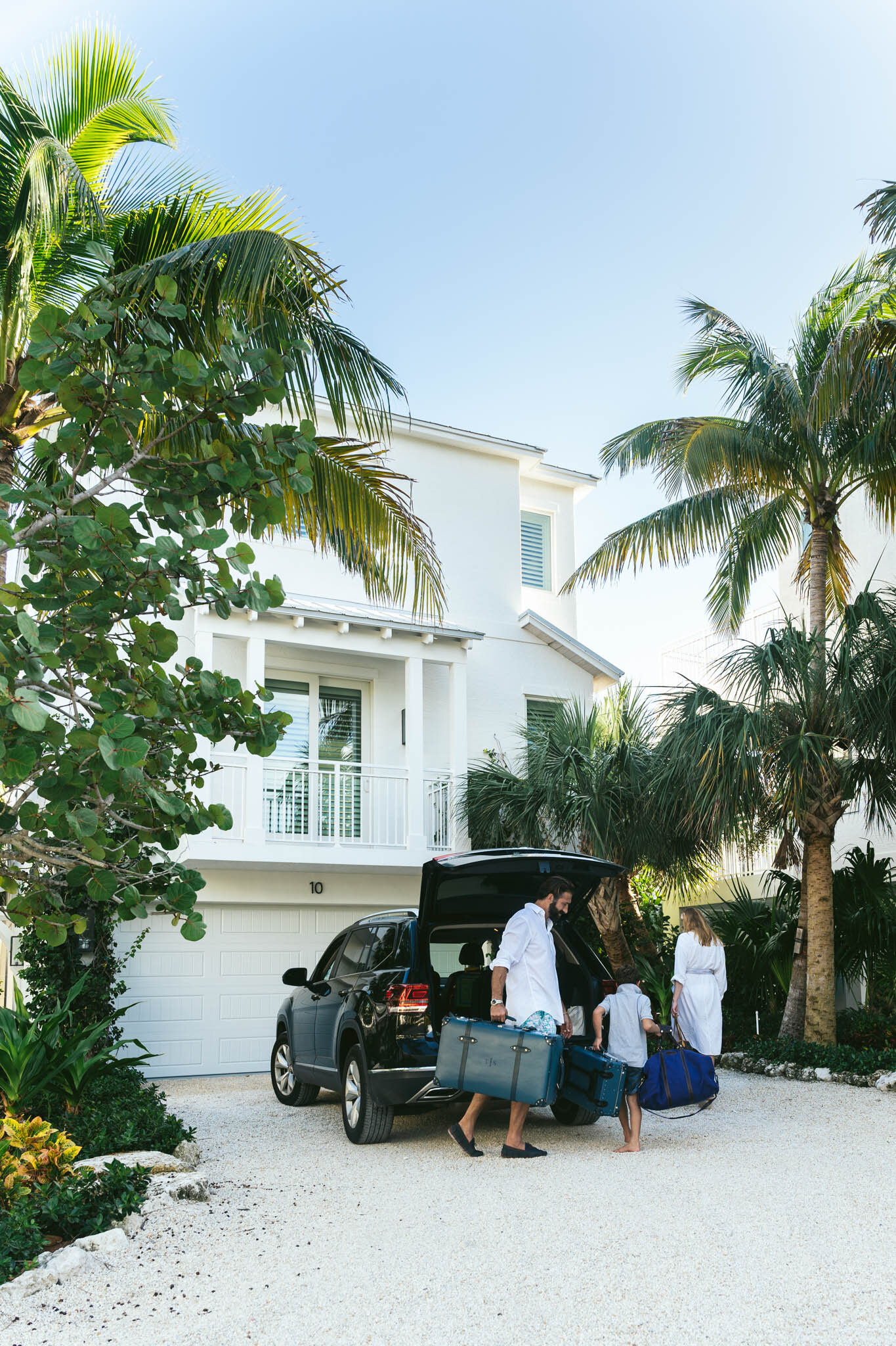  Family unpacks their car as they arrive at their Islands of Islamorada waterfront villa. 