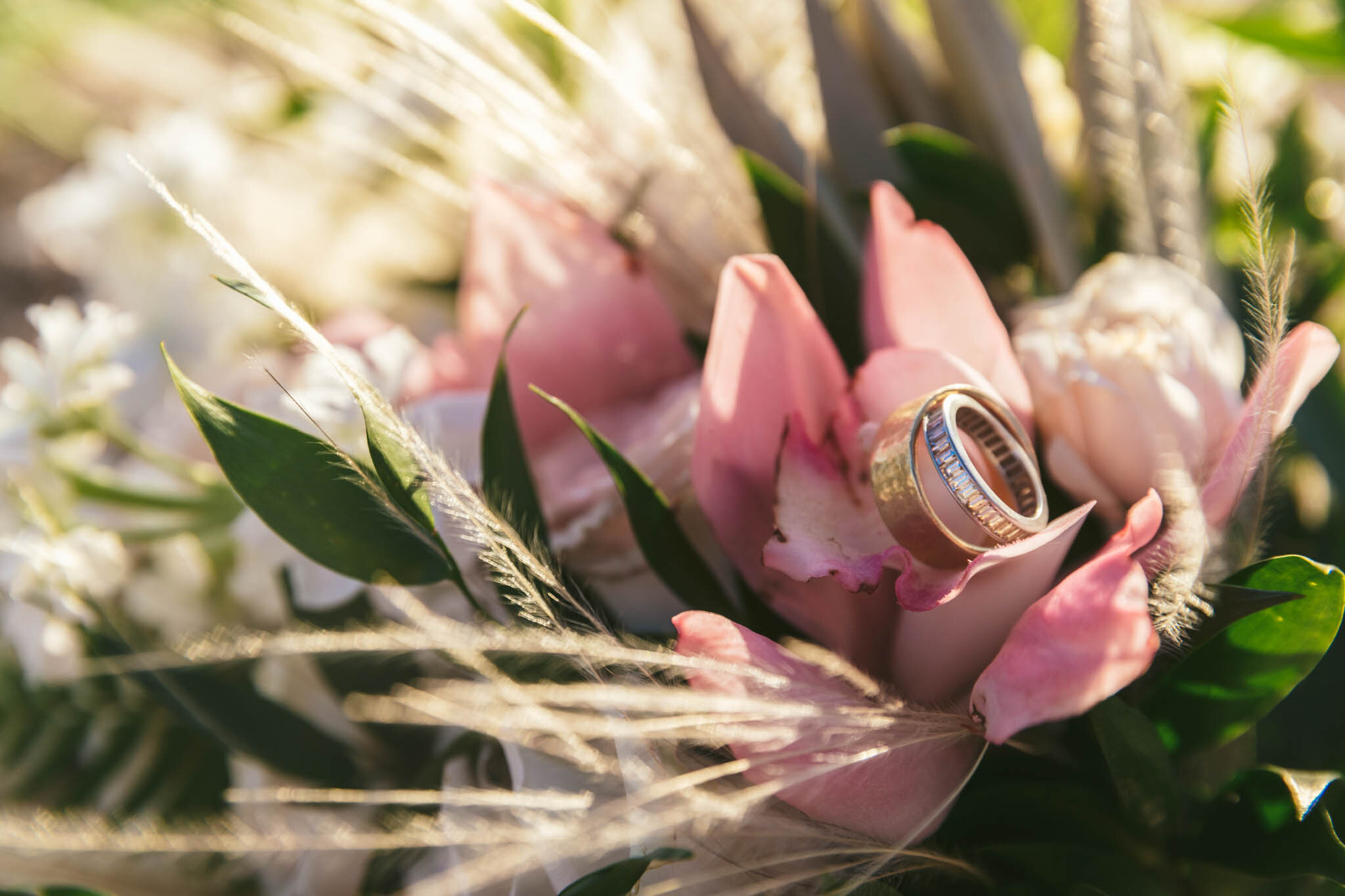  Wedding rings sit on a bouquet of flowers on The Islands of Islamorada’s private beach. 